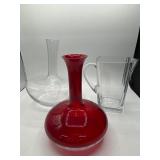 Three Clear and Red Glass Vessels