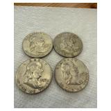 Four 1957 Franklin Half Dollars