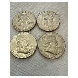 Four 1957 Franklin Half Dollars