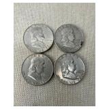 Four 1950s Franklin Half Dollar Coins