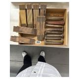 Box Lot of Folding Rulers and Railroad Spikes