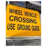 Yellow Metal Wheel Vehicle Crossing Sign
