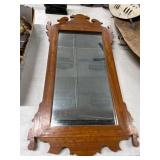 Wood-Framed Wall Mirror with Ornate Details