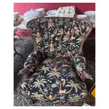 Upholstered Armchair With Carved Details