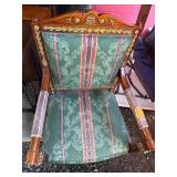 Ornate Wooden Armchair with Damaged Upholstery