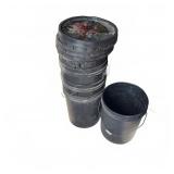Stack of Black Plastic Utility Buckets