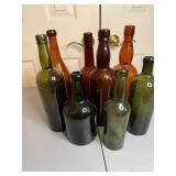 varied collection of seven vintage glass bottles