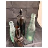 Four vintage glass bottles