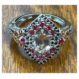 SIZE 7 RING IN STERLING W/ RED STONES