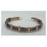GOLDTONE WIRE BANGLE WITH AMETHYST STONE