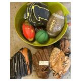 Baseball gloves and footballs