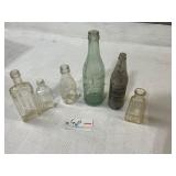 Lot of glass embossed  bottles