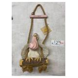 It's a girl pelican figurine