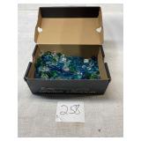 Shoebox full of glass rocks