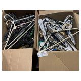 Two large boxes of plastic hangers