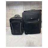 2 large rolling suitcases