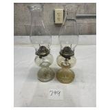 matching set of clear glass hurricane oil lamps
