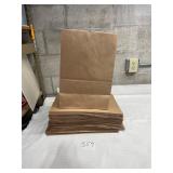 Stack of large brown paper grocery bags