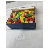 Shoebox full of wooden building blocks