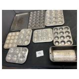 large lot of muffin and baking trays