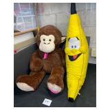 large stuffed plush monkey and banana