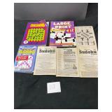 lot of crossword and Sudoku puzzle books