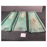 3 green plastic downspout splash guards