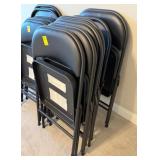 Stack of Black Folding Chairs