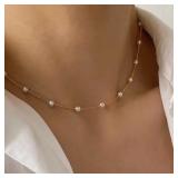 A women's beaded pearl lace gold gothic pendant...