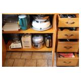 Contents of Lower Kitchen Cabinet near oven