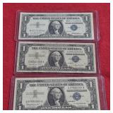 Three 1957 Blue Seal US $1 Silver Certificates