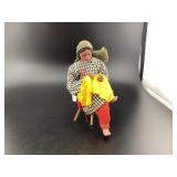 Handmade doll isreal women sewing sitting on a