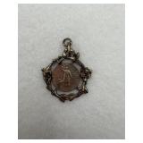 A sterling silver pendant that resembles a