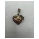 Vintage sterling silver heart pendant with love