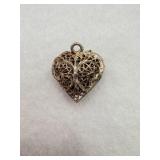 A sterling silver filigree heart pendant