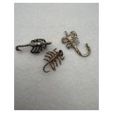 A variety of different sterling silver scorpion