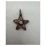 Sterling silver star pendant with a stone in the