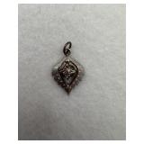 A sterling silver a leaf shaped pendant with a