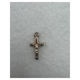 A sterling silver crucifix charm