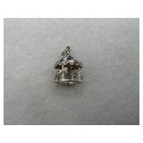 A sterling silver carousel charm with gemstone