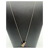 A sterling silver necklace megaphone pendant.