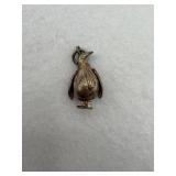 A sterling silver penguin pendant with movable