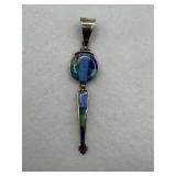 Sterling silver pendant with a multi stone inlay.