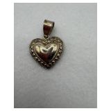 A heart shaped sterling silver pendant