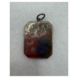 A sterling silver rectangular locket with a