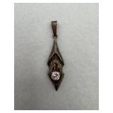 A sterling silver a rhombus shaped with a diamond