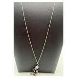 A sterling silver chain necklace with stone and