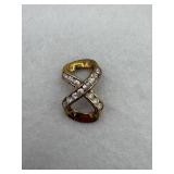 A sterling silver infinity design pendant with