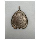 A sterling silver pendant with a 1896 US Morgan