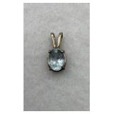 A sterling silver blue oval gemstone pendant
